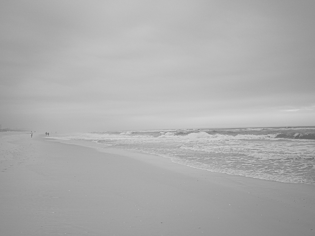 Black and White photography of people at the beach