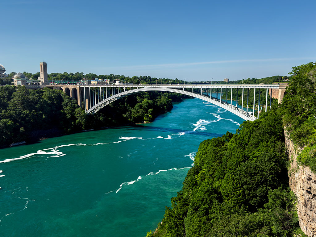 Photography of bridge connecting Canada to the United States